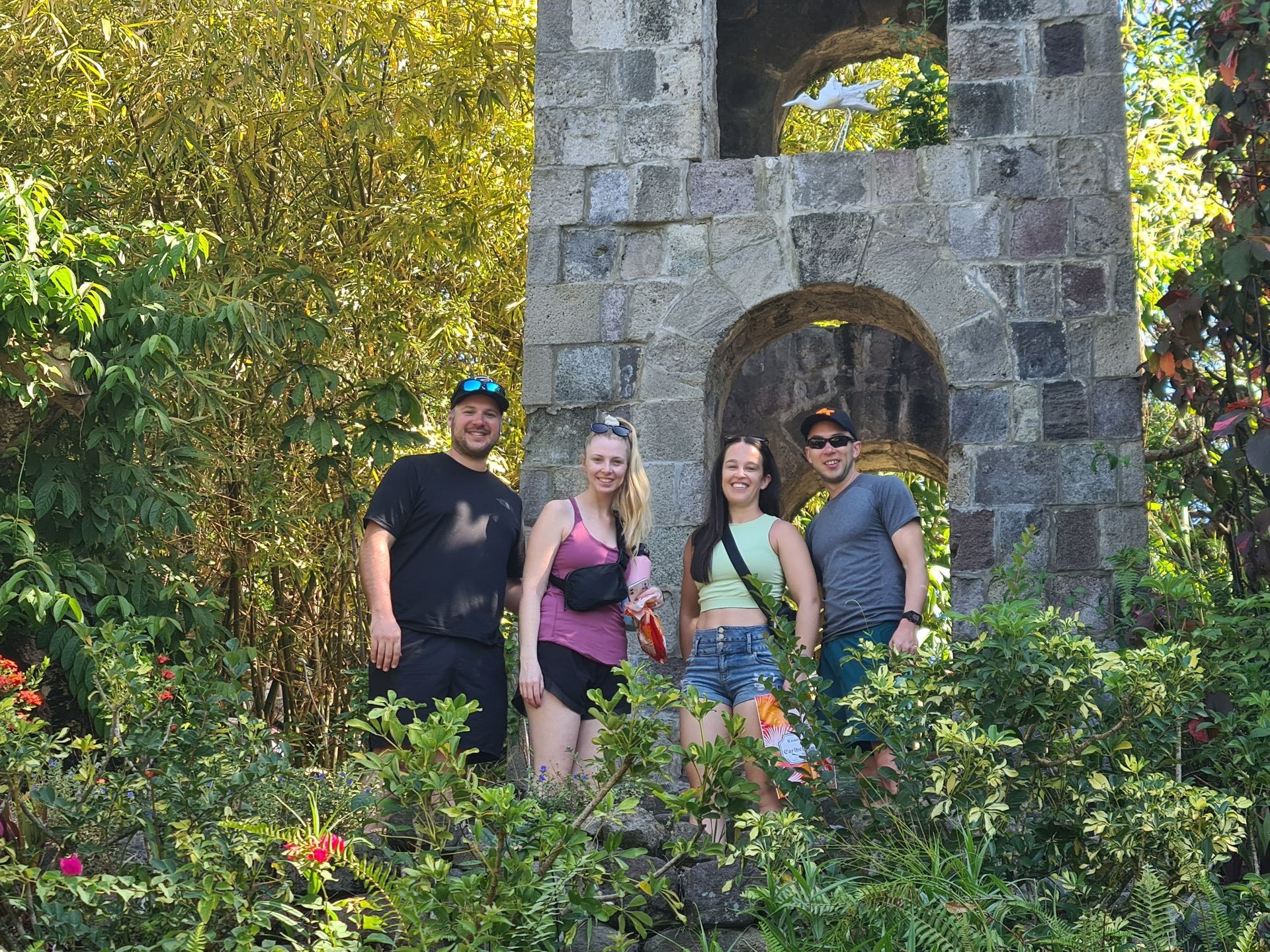 2 couples pose at a old fort, romney manor st kitts